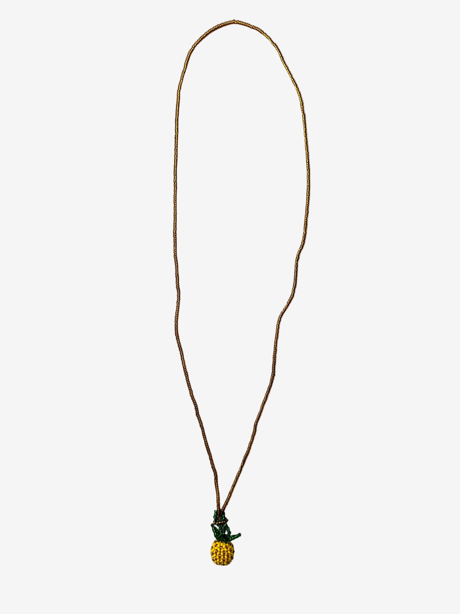 Pineapple Sol necklace detail showing gold chain and handmade pineapple beadwork