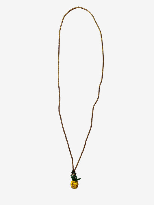 Pineapple Sol necklace detail showing gold chain and handmade pineapple beadwork