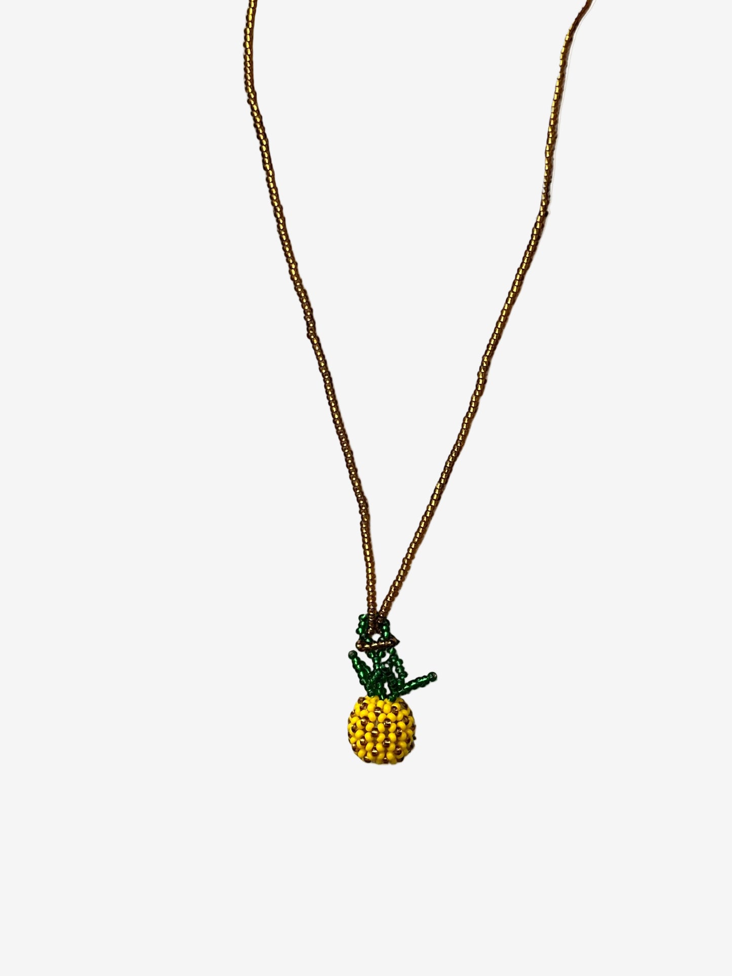 Pineapple Sol necklace with gold beaded chain and yellow pineapple pendant front view