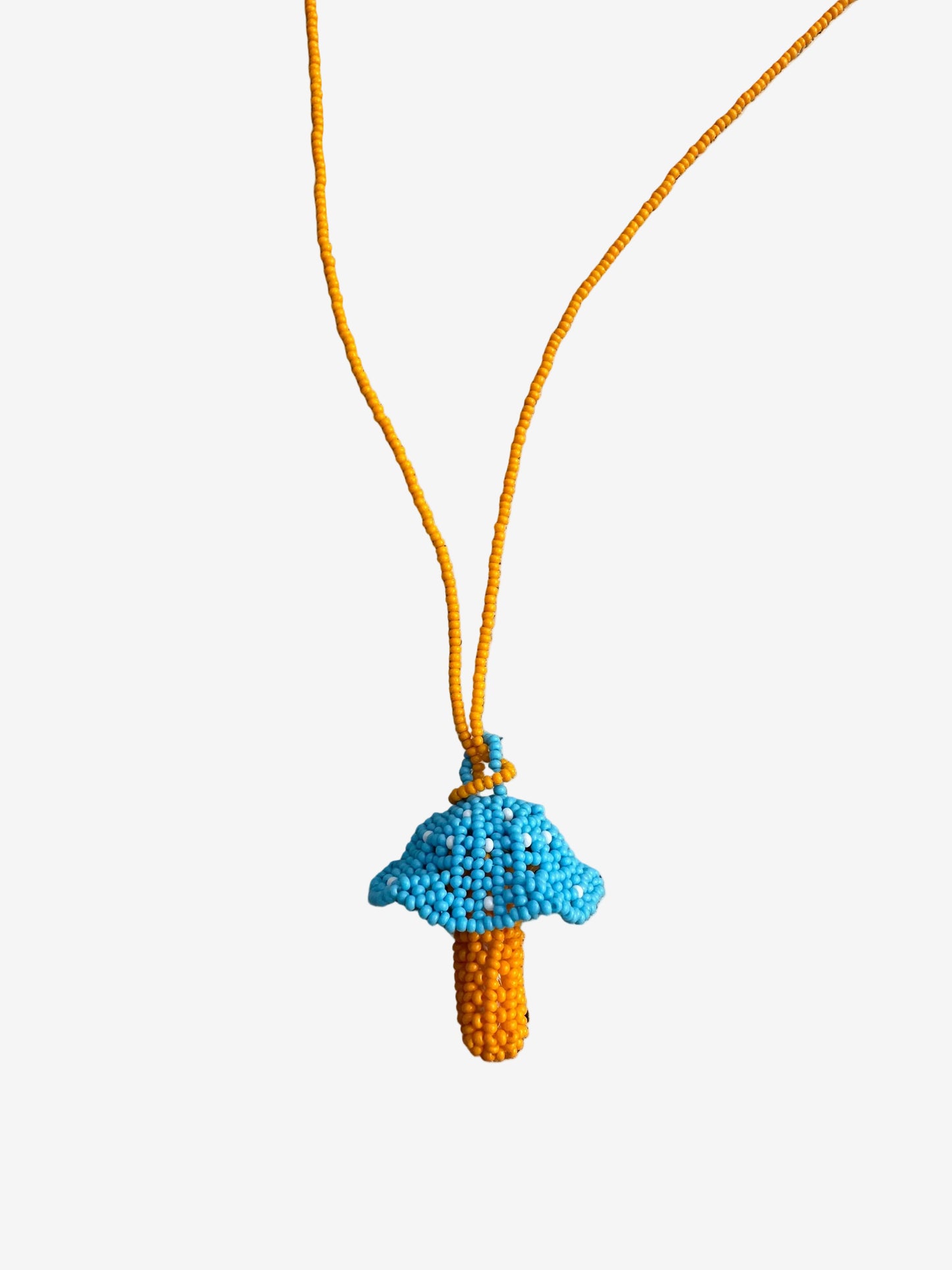 Bluecap fungi necklace hanging with yellow beaded cord handmade by Guava