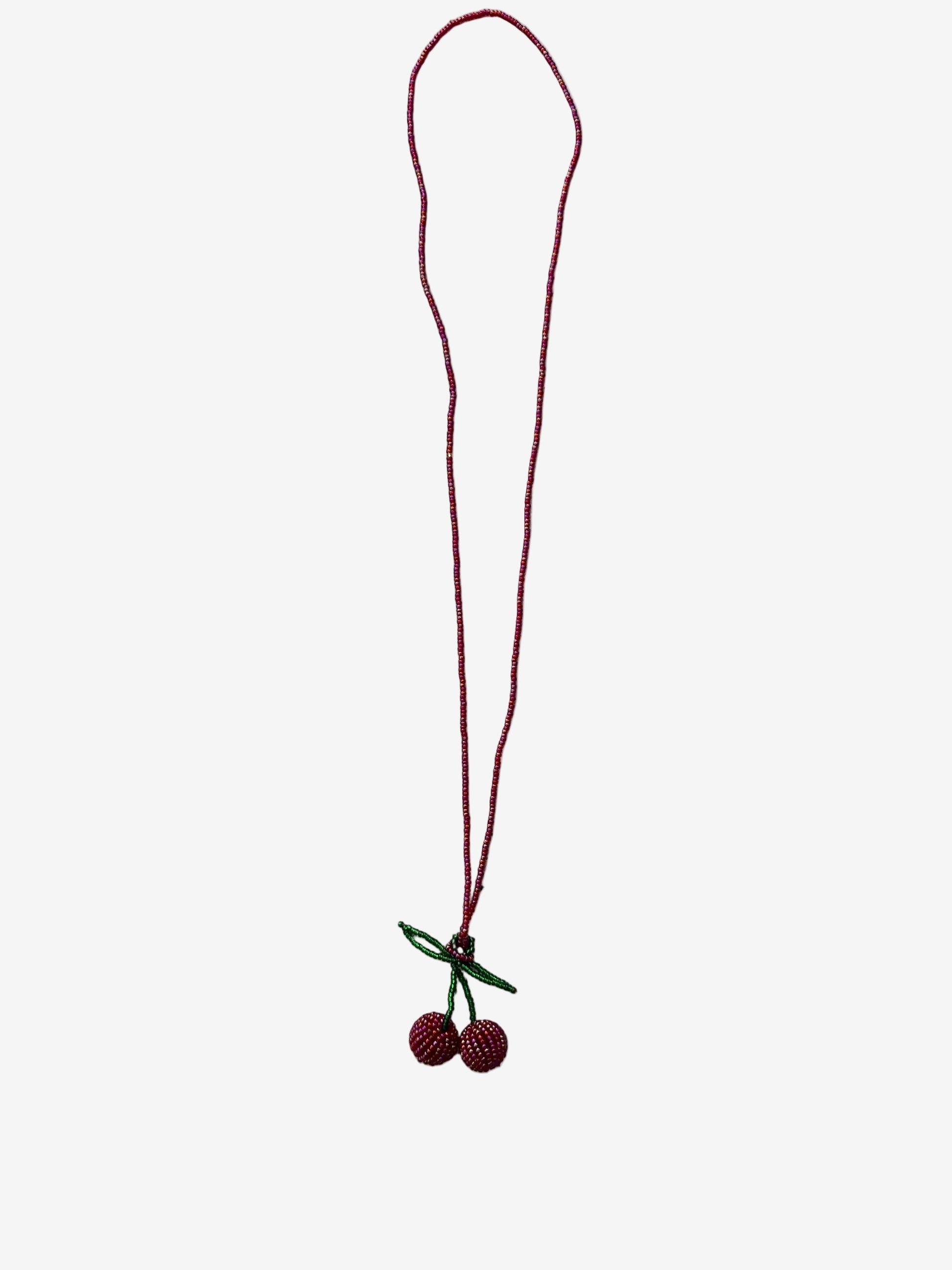 Gloss cherry necklace showing reflective red beads and detailed texture close up