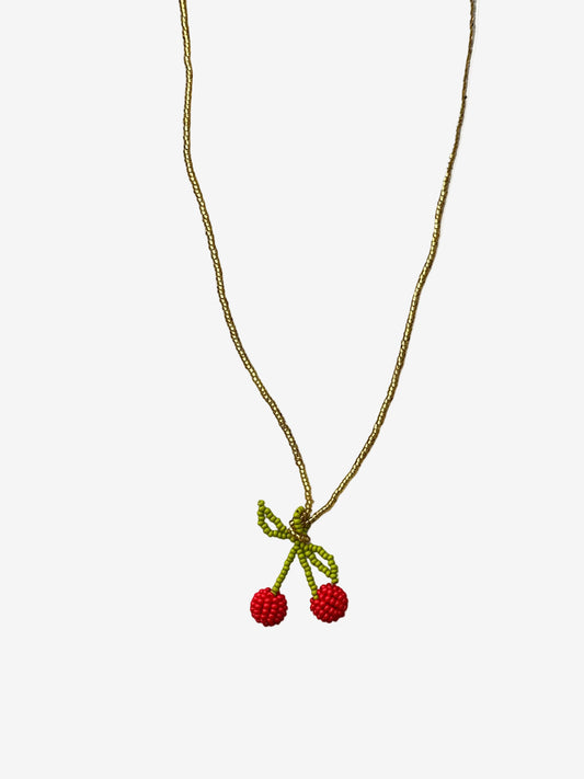 Deep red cherry necklace with gold chain showing detailed beadwork and texture