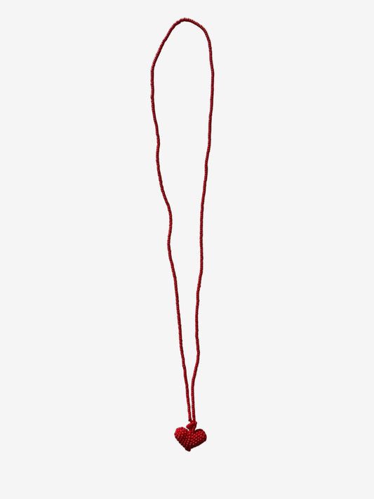 Red string with a heart charm