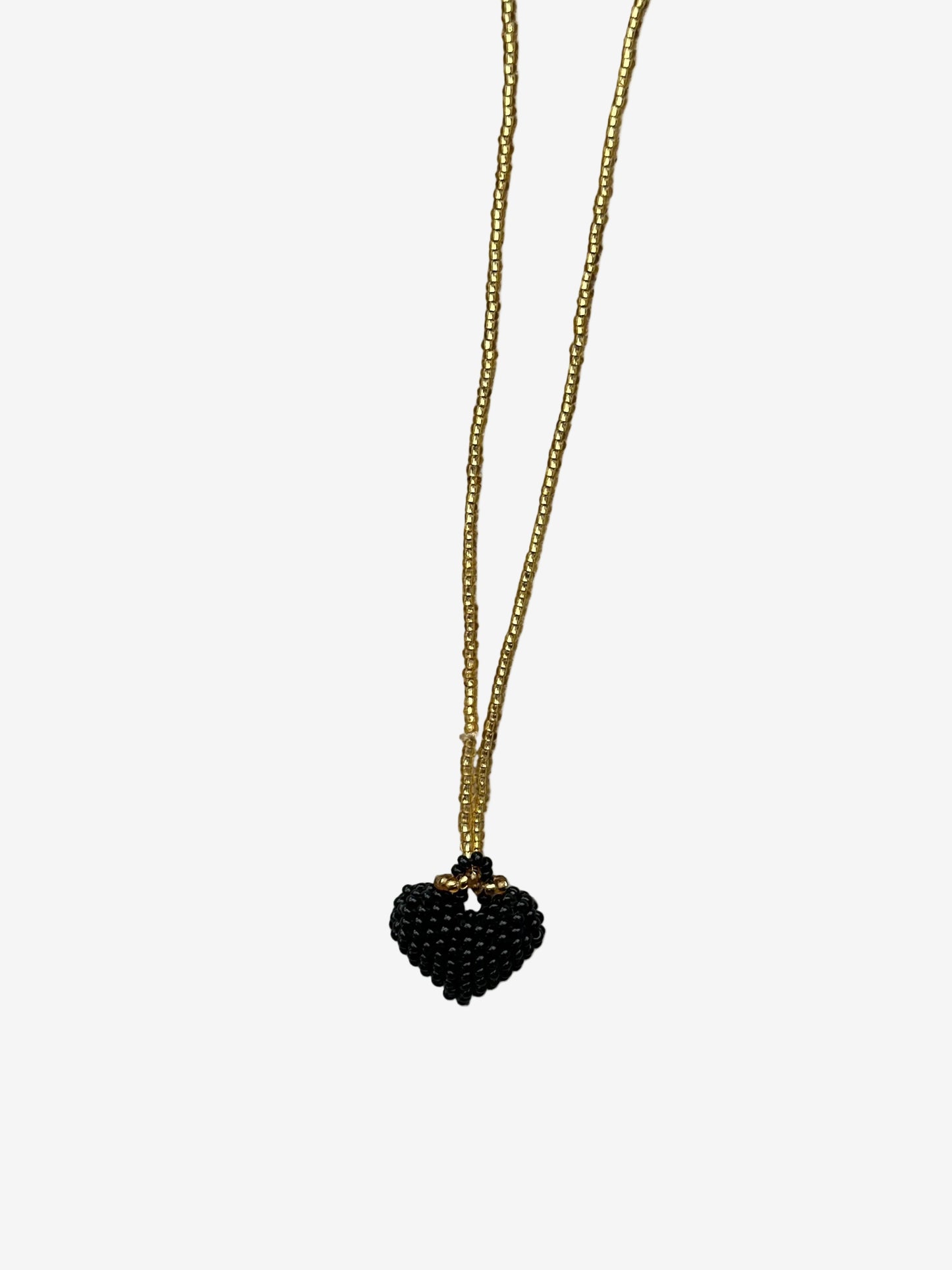 Heart Noir necklace with black beaded heart pendant and gold chain front view