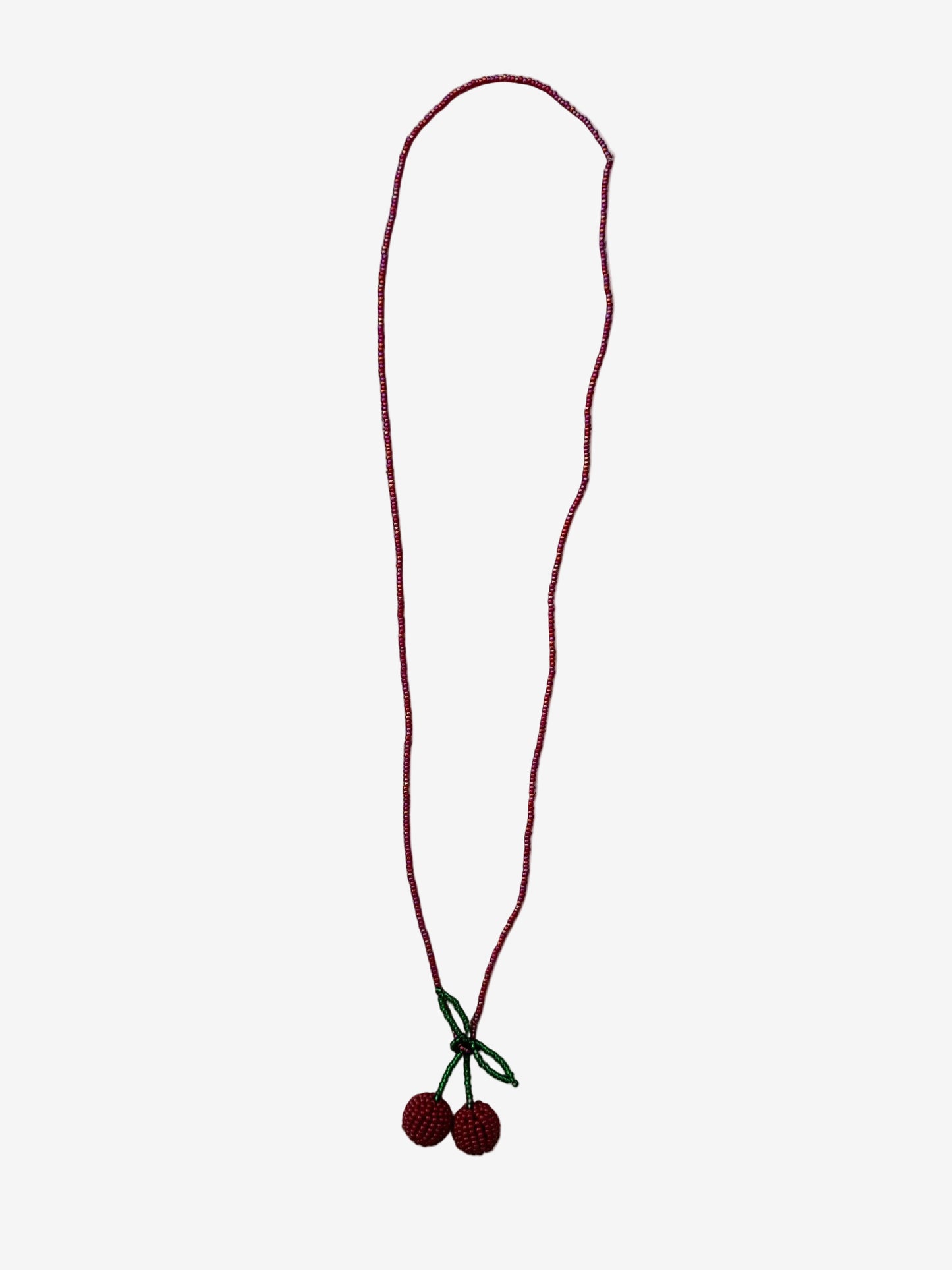Velvet cherry necklace showing tonal red beads and detailed texture close up