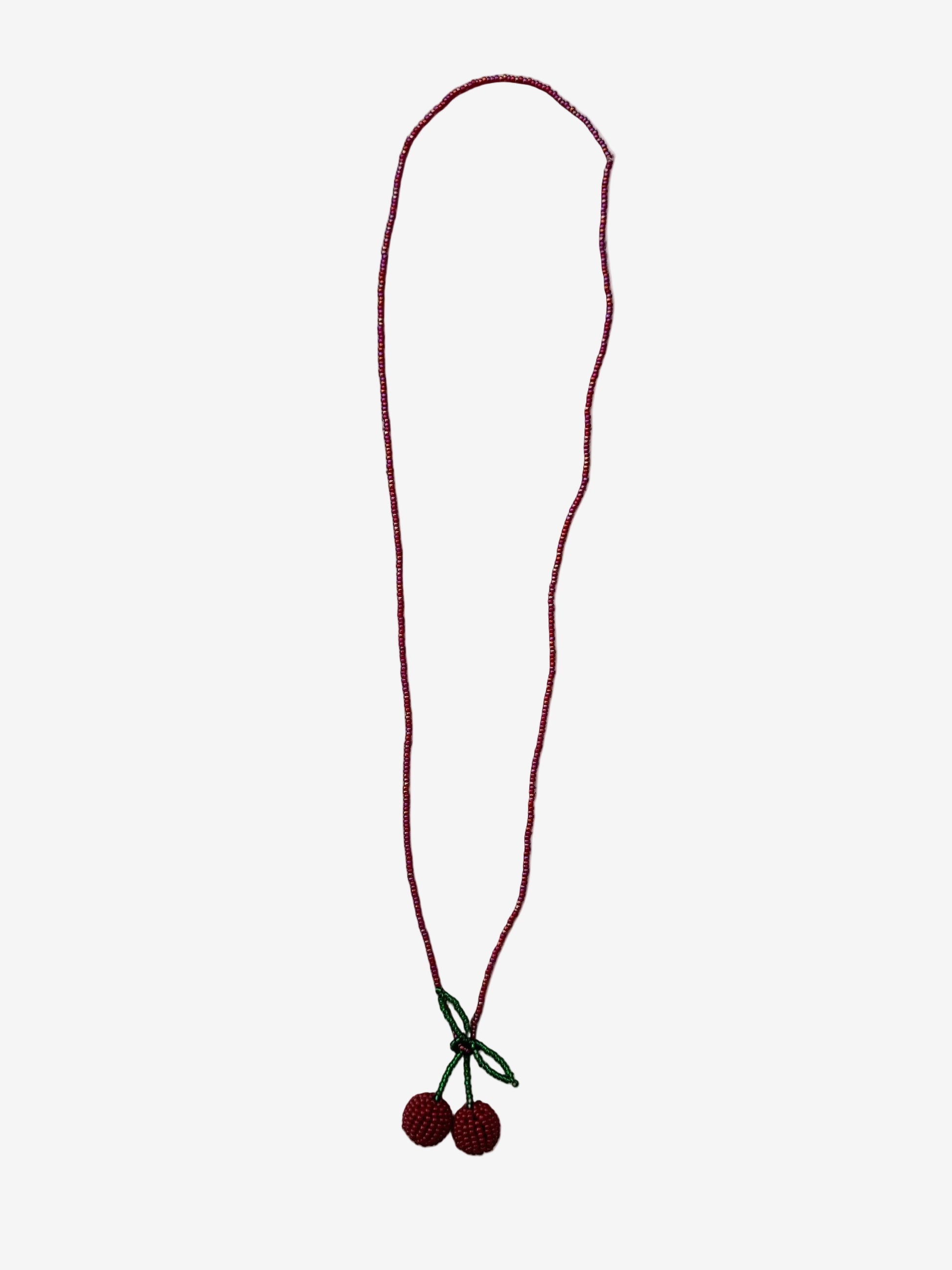 Velvet cherry necklace showing tonal red beads and detailed texture close up