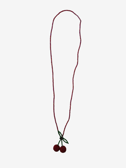 Velvet cherry necklace showing tonal red beads and detailed texture close up