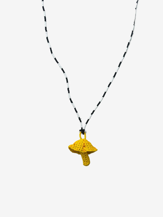 Yellow fungi necklace with black and white beaded chain handmade by Guava
