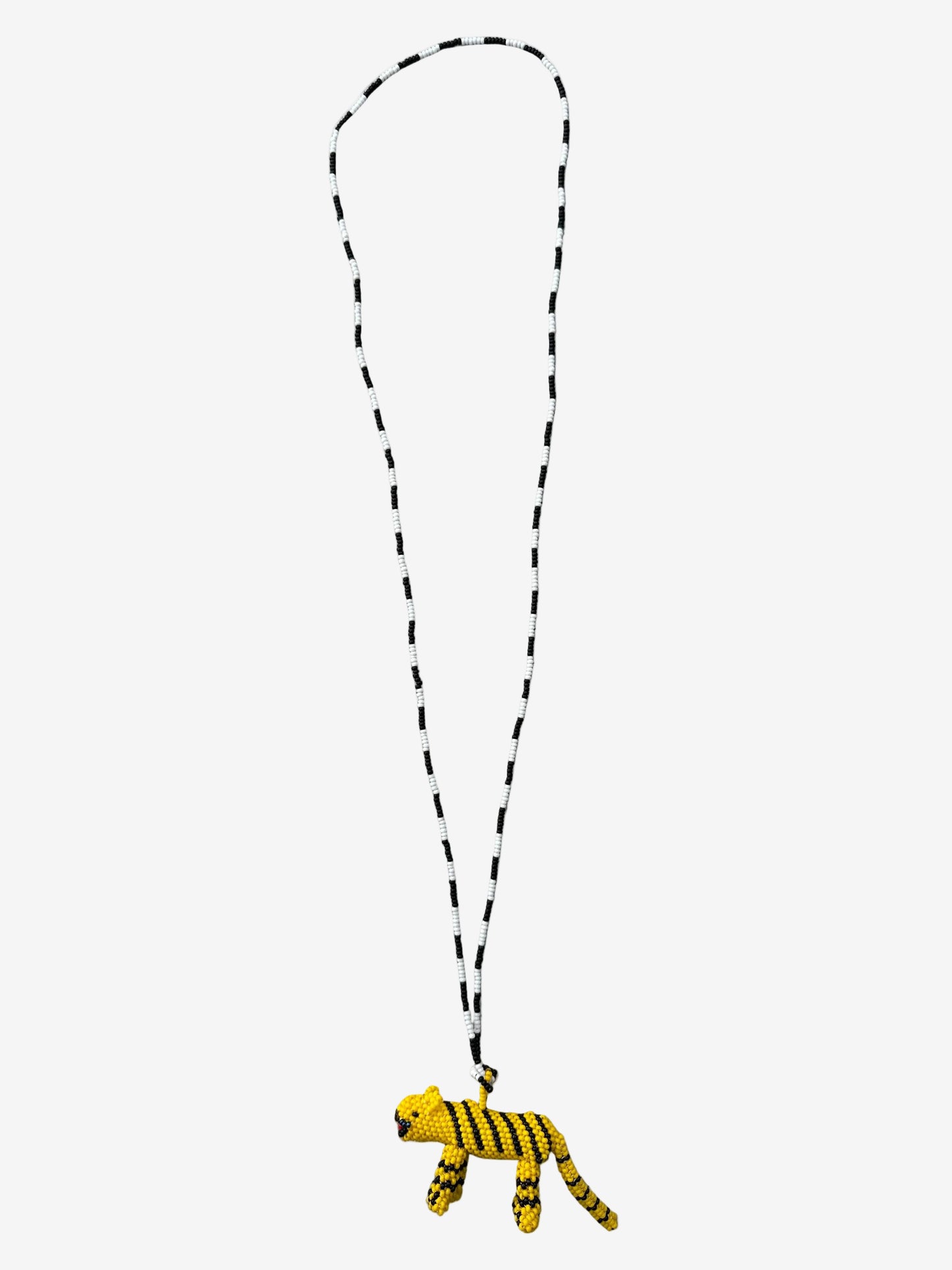 Yellow tiger-shaped pendant on a chain 