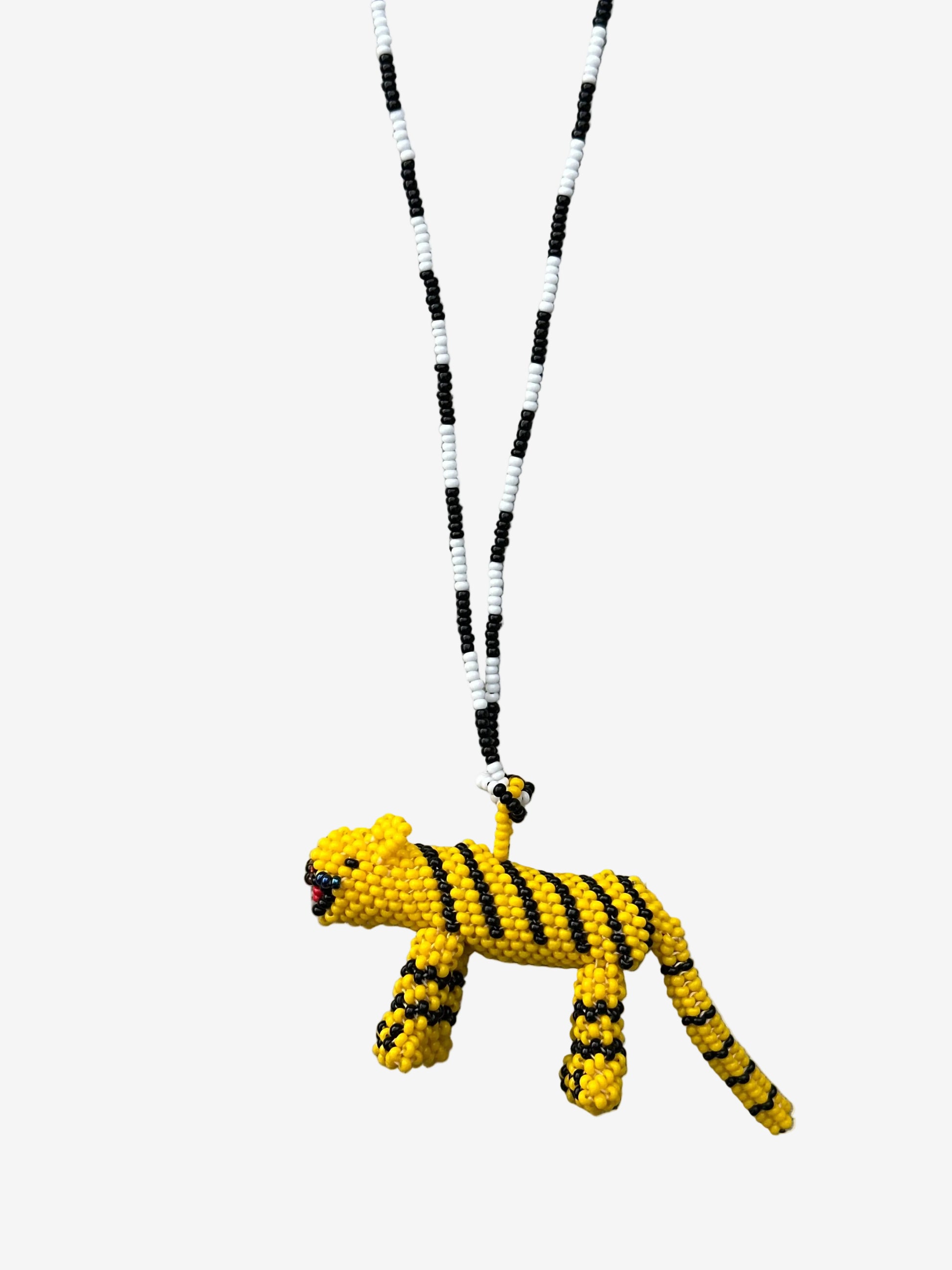 Handmade beaded tiger necklace with black and white strand and yellow tiger pendant